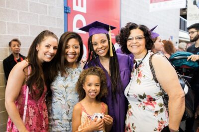 graduate with her family in photo