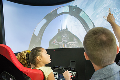 Kids inside a spacecraft simulator